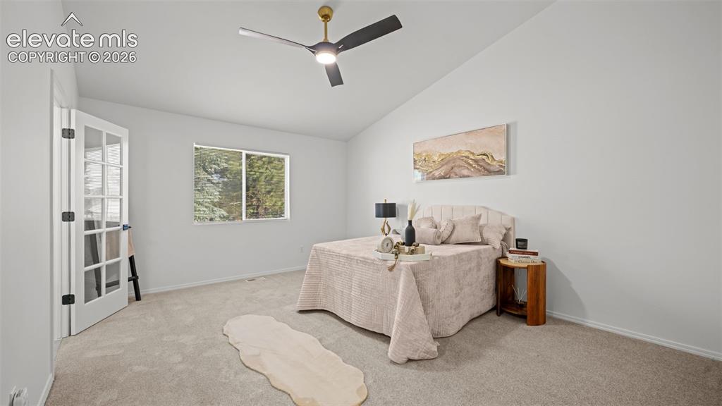 Image 19 of 46: Vaulted ceilings complement the neutral wall tones and plush carpeting