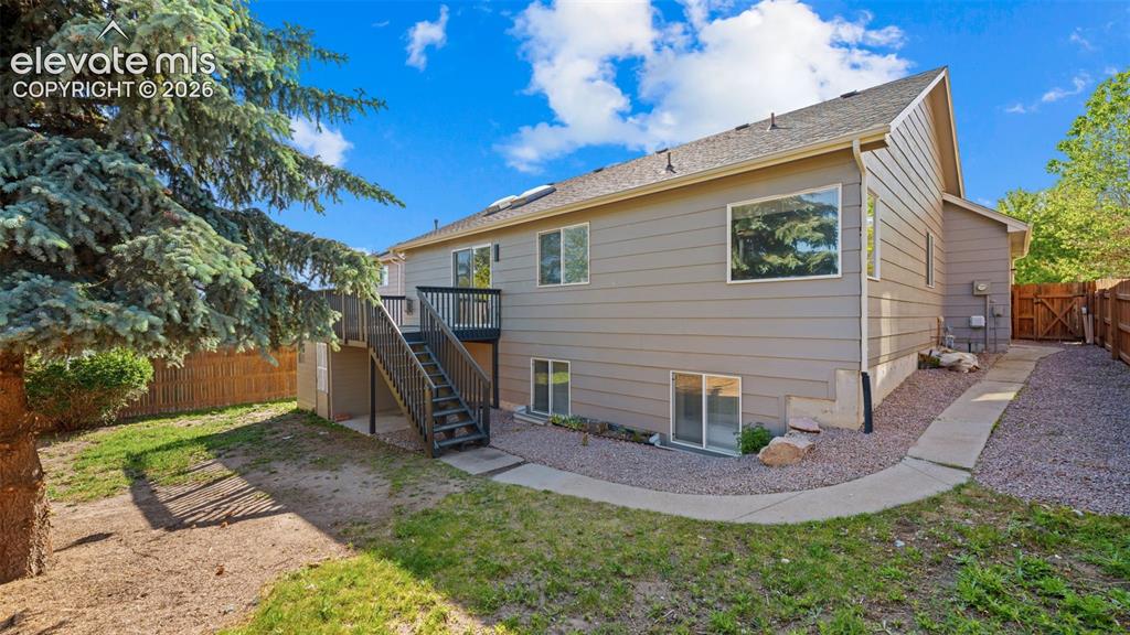 Image 32 of 46: Backyard featuring a multi-level deck, direct access to the interior, a con