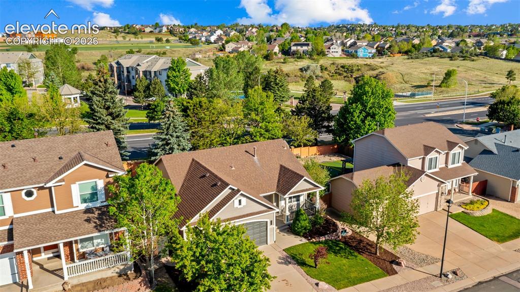 Image 38 of 46: Aerial perspective showcasing a residential street with diverse home styles