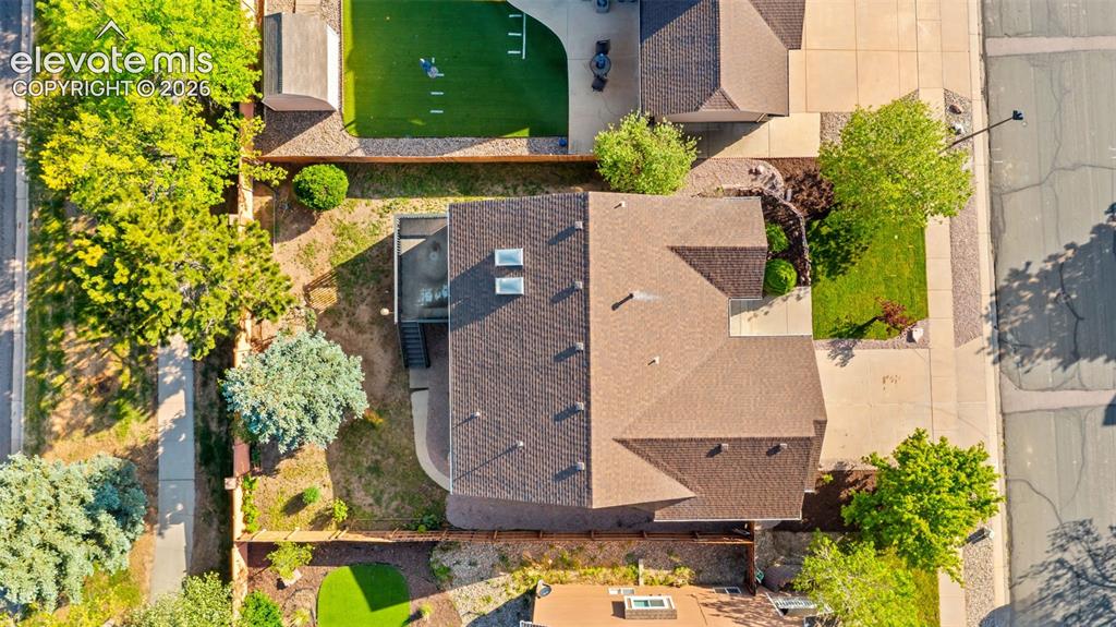 Image 46 of 46: Brown shingle roofline with multiple gables and two skylights