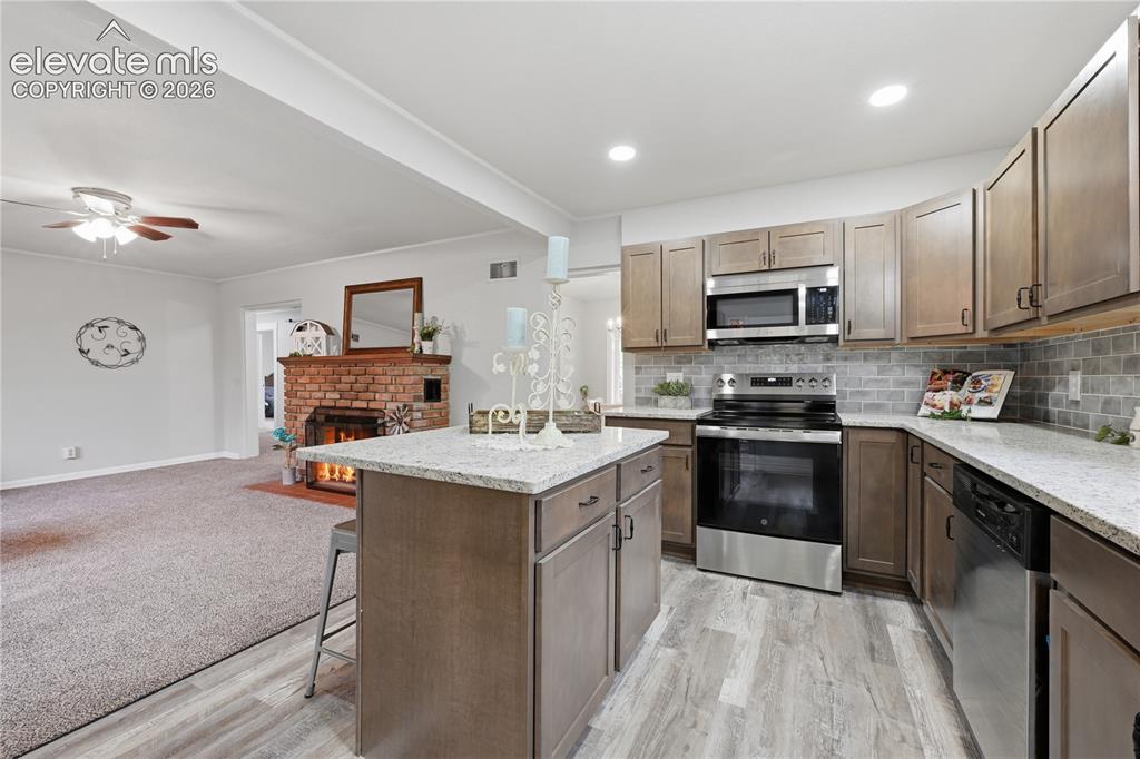 Image 11 of 50: Imagine entertaining with this open floor plan!