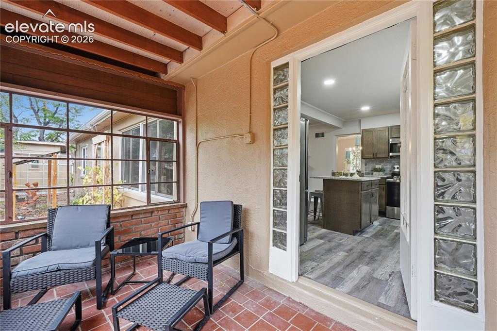 Image 13 of 50: The entrance to the kitchen from the sun room.