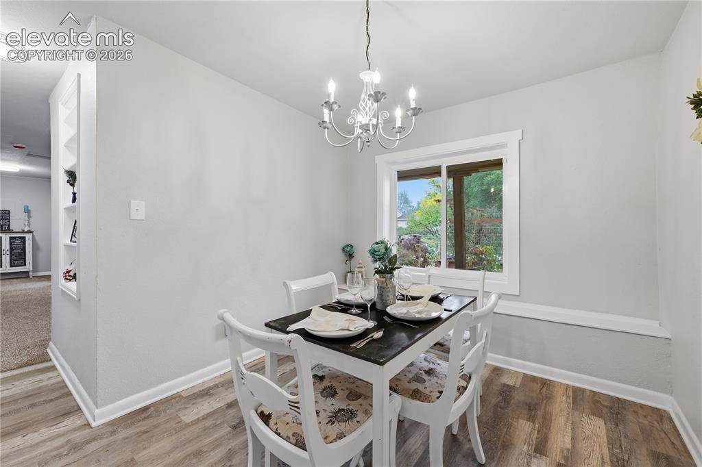 Image 14 of 50: The formal dining room just off the kitchen.