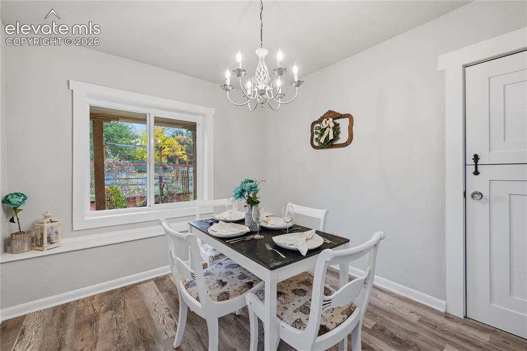 Image 15 of 50: Another view of the dining room. The door to the right is a Dutch door that