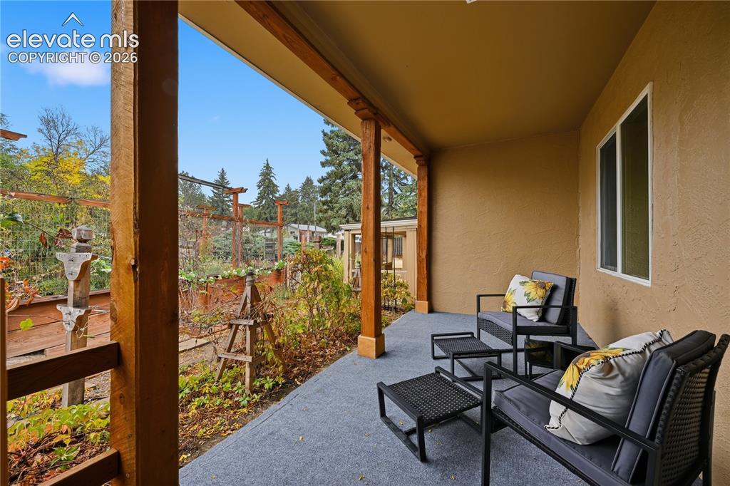 Image 2 of 50: The front porch of the home. Imagine enjoying your favorite beverage and en