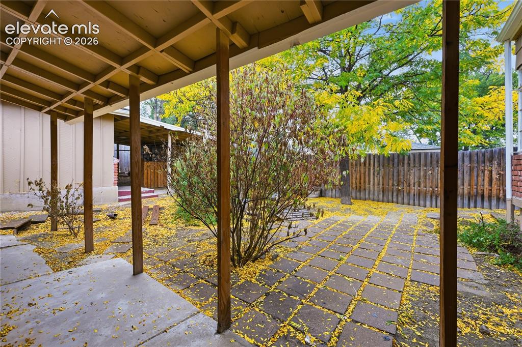 Image 41 of 50: The patio cover over the apartment rear door.