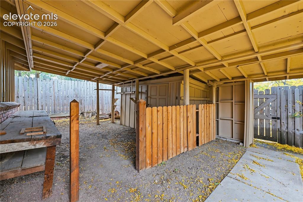 Image 42 of 50: One of the multiple out buildings. Also, a work bench in this work space.