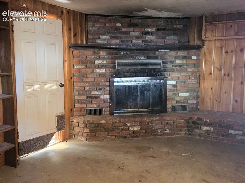 Image 48 of 50: The other side of the wood paneled side of this extra space. So many possib
