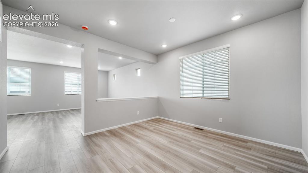 Image 5 of 34: Light wood-finish flooring complements the neutral wall tones
Photos of a