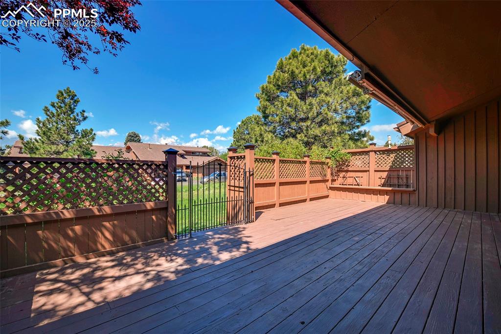 Image 16 of 25: Wooden terrace with a gate