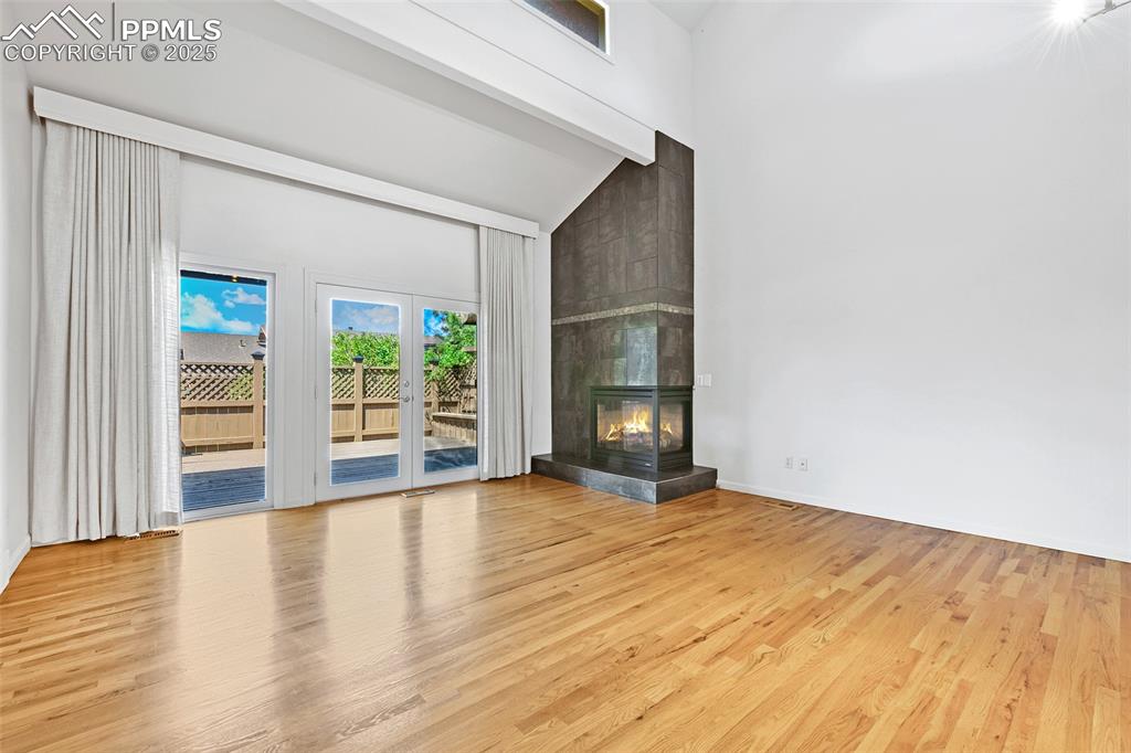 Image 4 of 25: Living Room/Dining Room features: walkout, beautiful wood flooring, high v