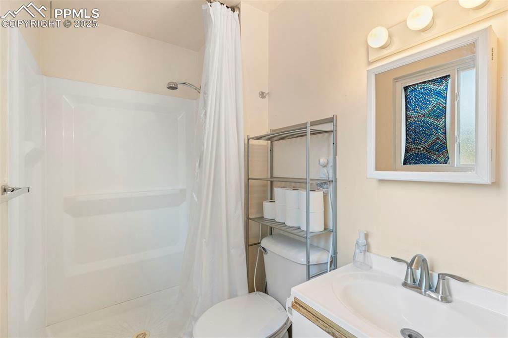 Image 15 of 32: Full bath featuring vanity and a stall shower