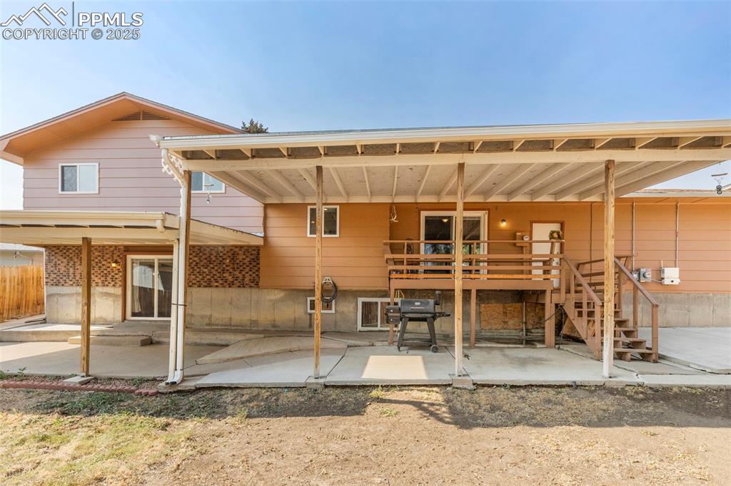 Image 23 of 32: Rear view of property featuring a patio area