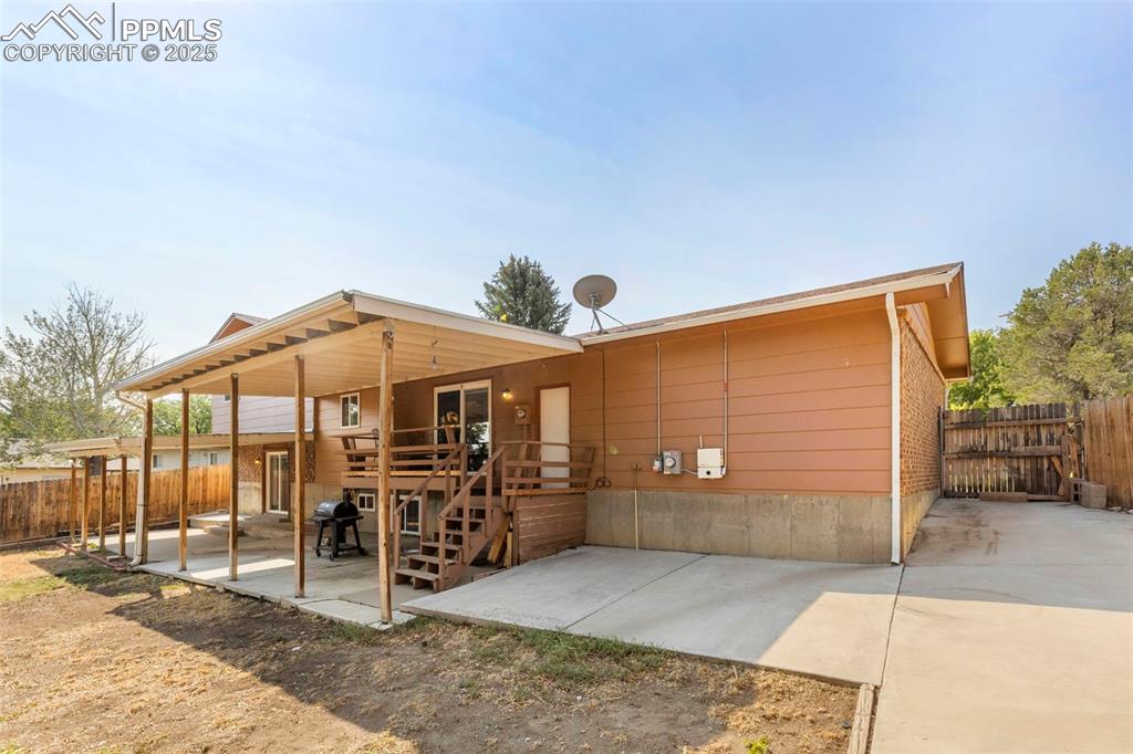 Image 25 of 32: Back of property with a patio area and a deck