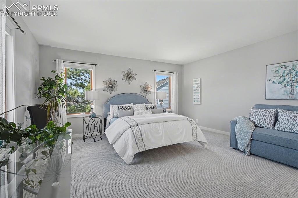 Image 28 of 50: secondary suite with attached bathroom and walkin closes