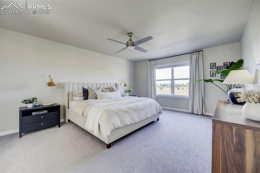 Image 16 of 50: Bedroom featuring carpet floors and a ceiling fan