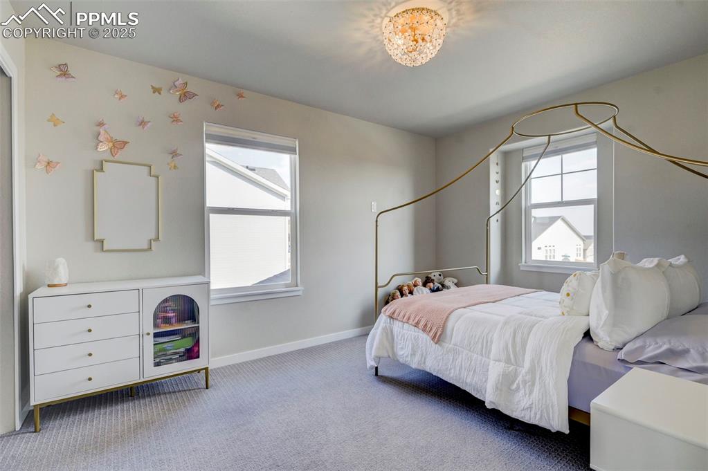 Image 26 of 50: Bedroom featuring carpet floors and baseboards