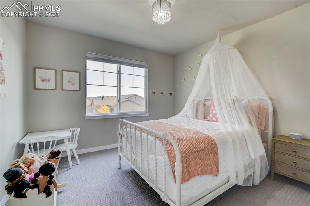 Image 28 of 50: Carpeted bedroom with baseboards