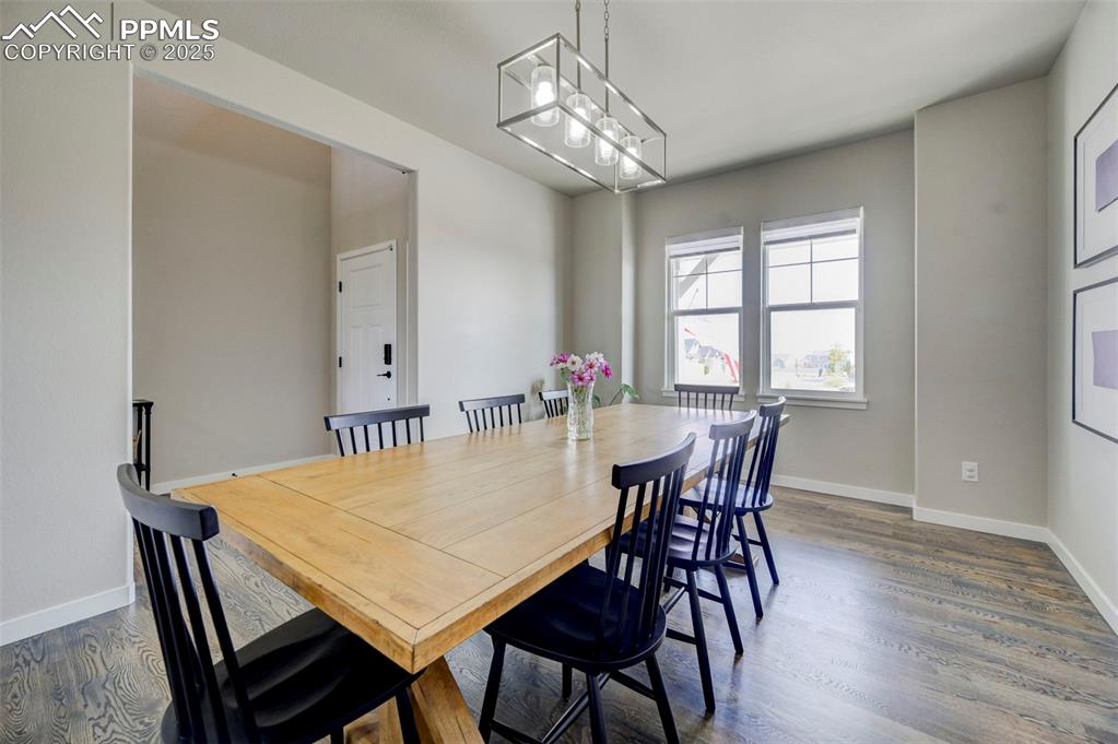 Image 4 of 50: Dining room featuring wood finished floors
