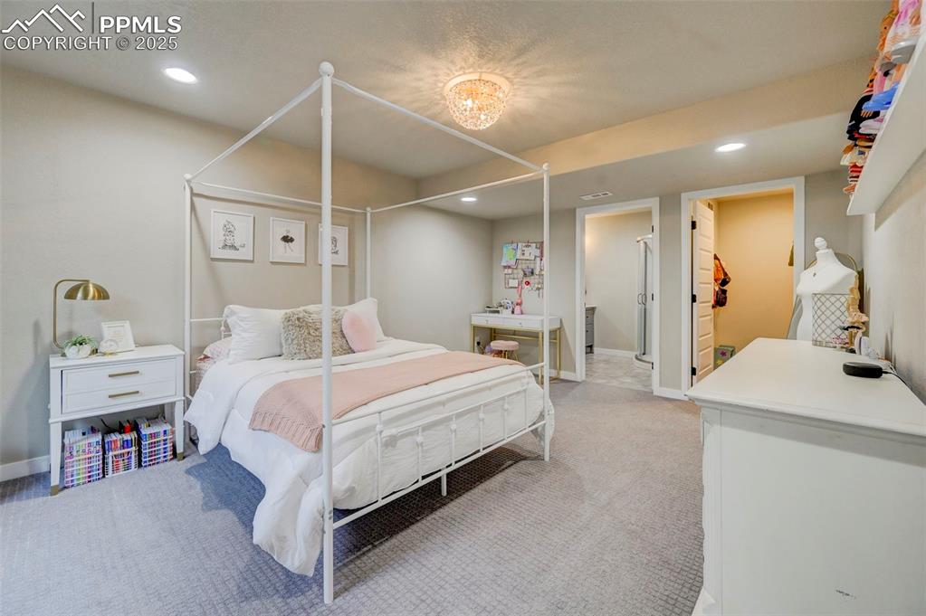 Image 44 of 50: Bedroom featuring recessed lighting and carpet