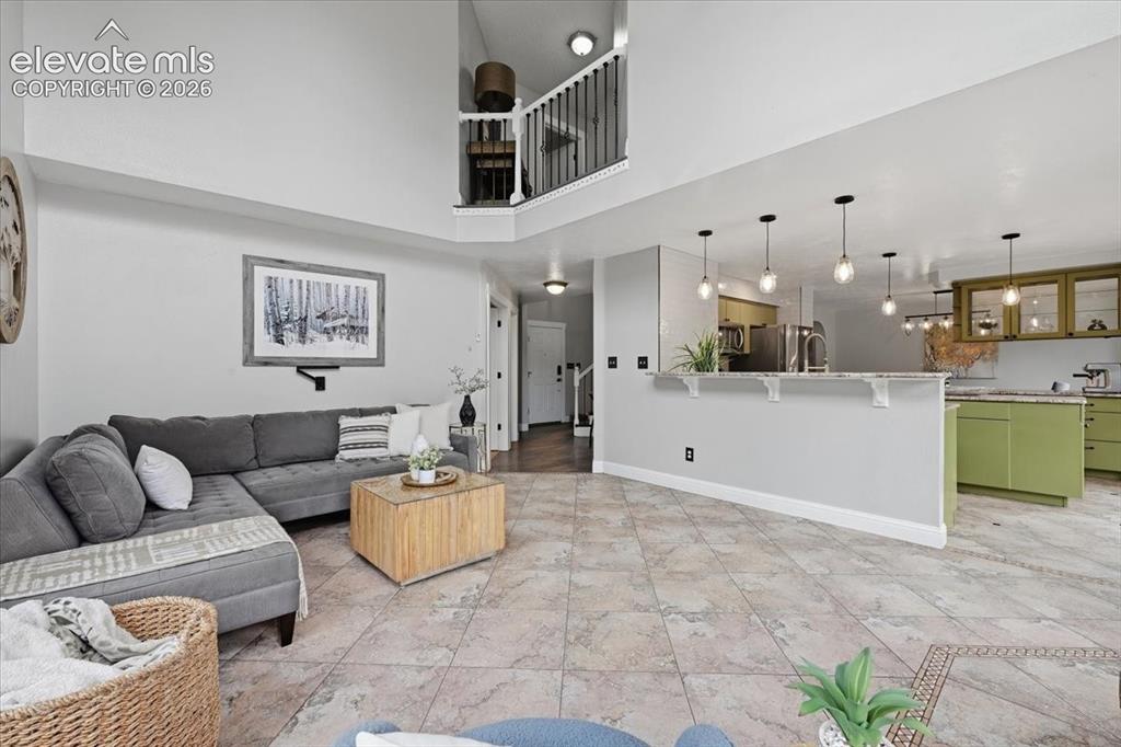 Image 17 of 50: Family room opens to the dining room and balcony!