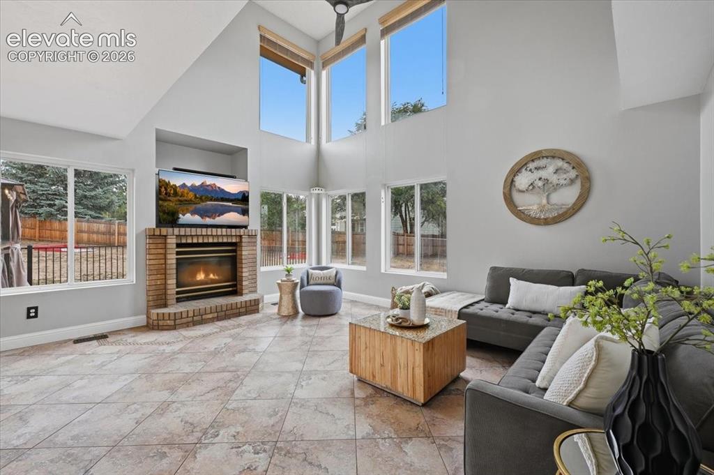 Image 18 of 50: Fireplace and upgraded white vinyl windows!  