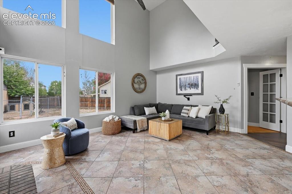 Image 19 of 50: Two story family room with space for large furniture!