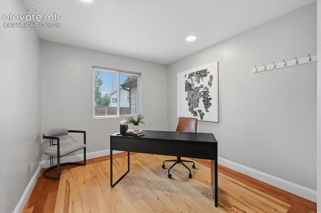 Image 20 of 50: Main level office with real wood flooring!