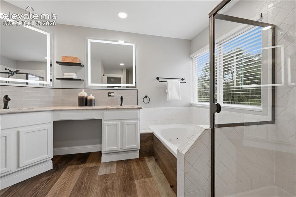 Image 25 of 50: Spa like five piece master bath with granite counters and upgraded mirrors!