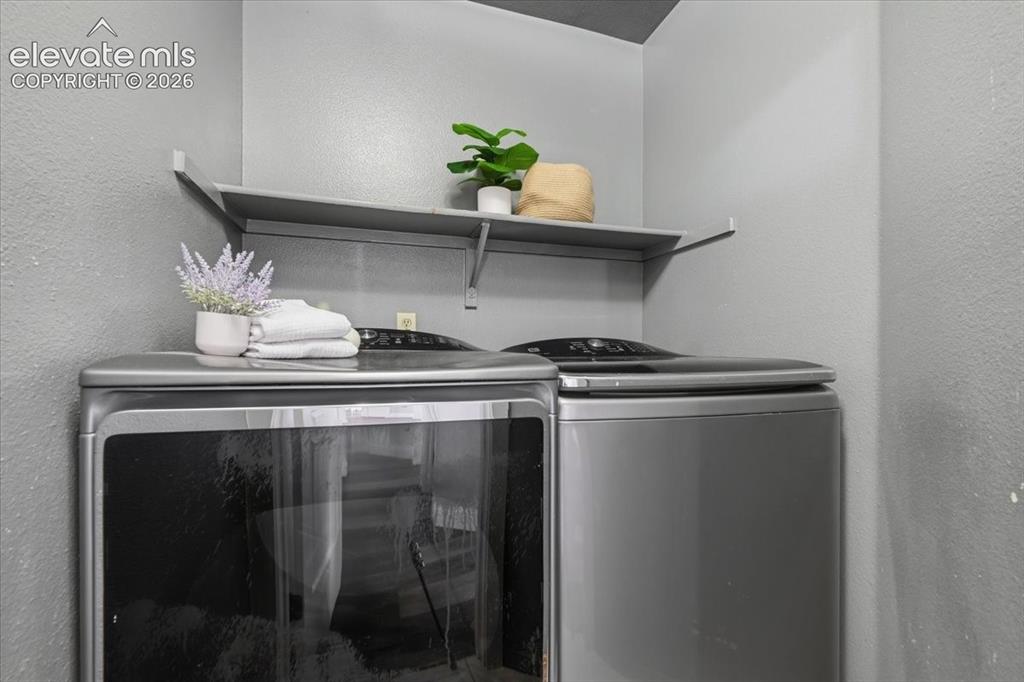 Image 31 of 50: Upstairs laundry room for easy living! Washer and dryer included!