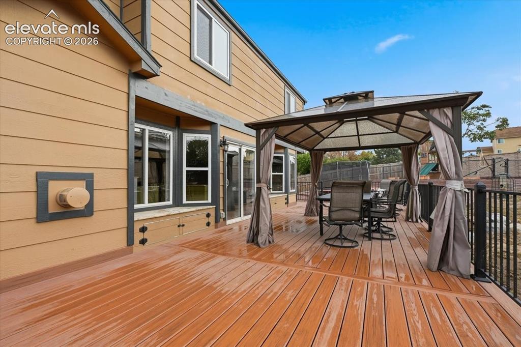 Image 43 of 50: Another view of the composite deck showing the granite window seats!