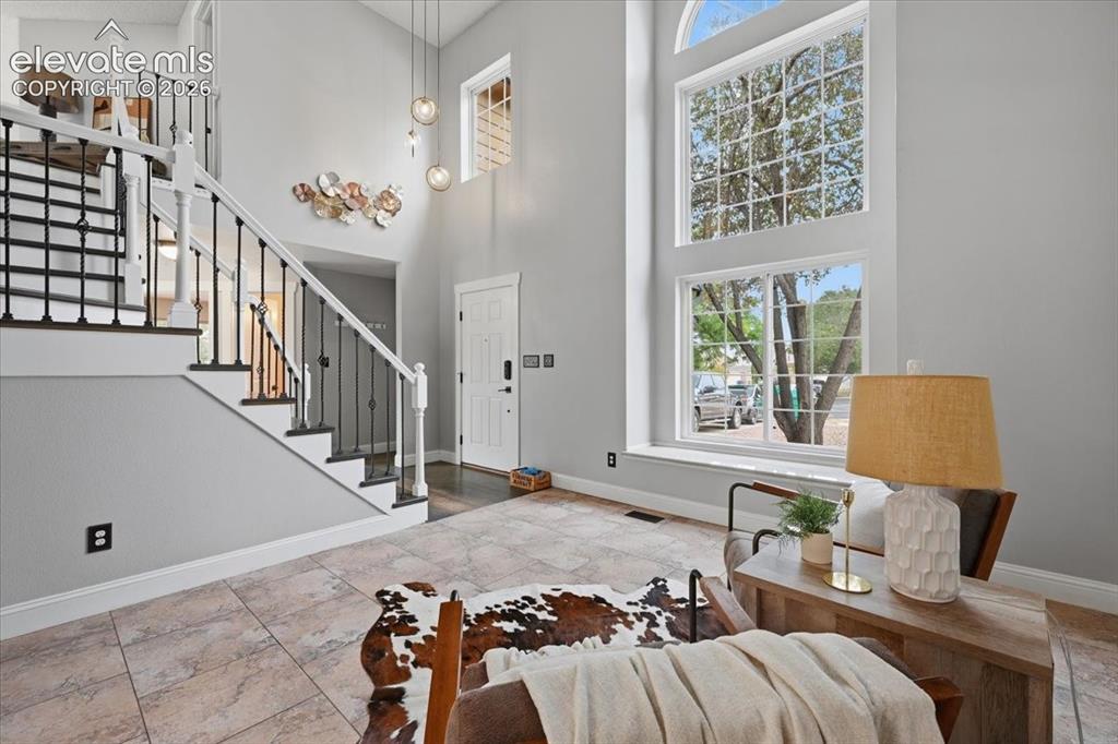 Image 8 of 50: Two story entry with real wood flooring!