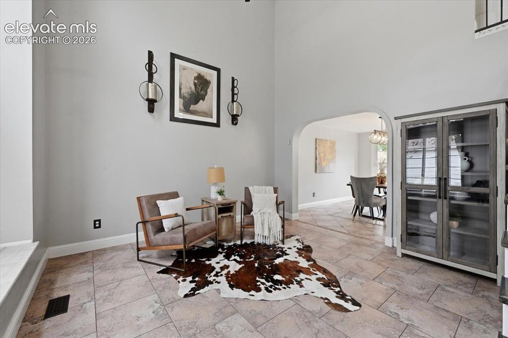 Image 9 of 50: Beautiful two story entry room greets you right away!