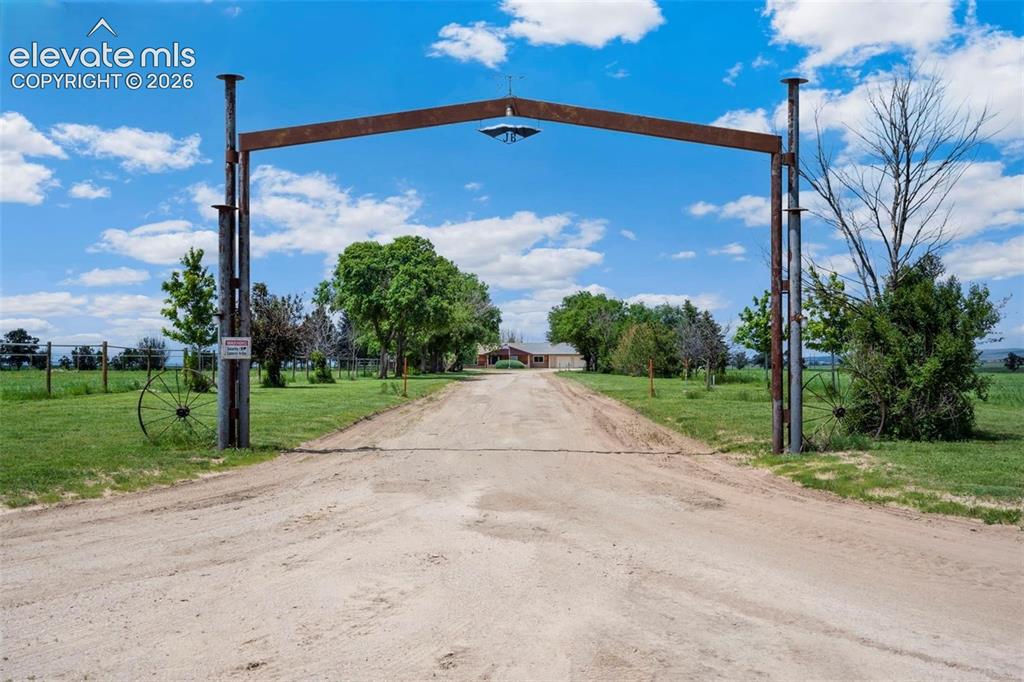 Image 1 of 20: Gate entry to property