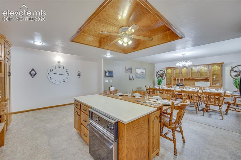 Image 11 of 20: Kitchen and dining room