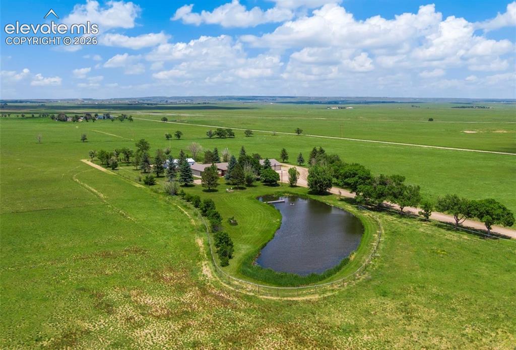 Image 2 of 20: Aerial view featuring private pond