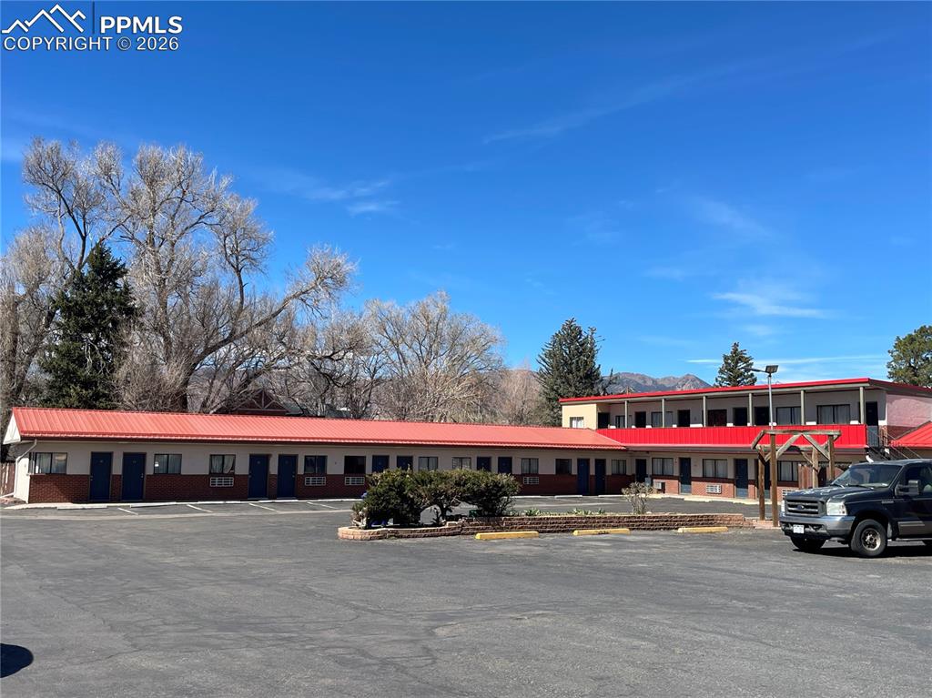 Image 4 of 6: View of property featuring uncovered parking