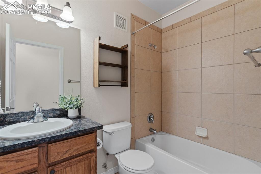 Image 22 of 27: Bathroom featuring shower / washtub combination and vanity