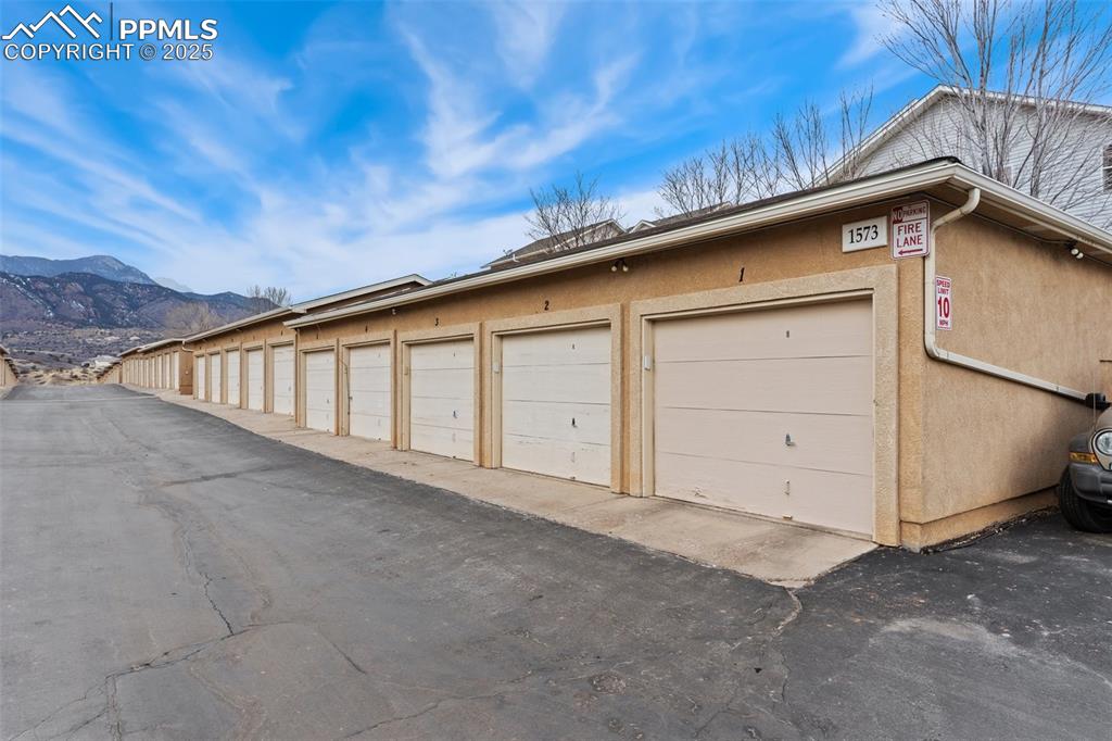 Image 24 of 27: Garage with a mountain view
