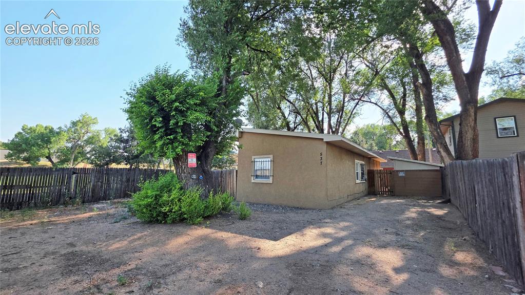 Image 2 of 9: Additional storage in the gated rear yard.