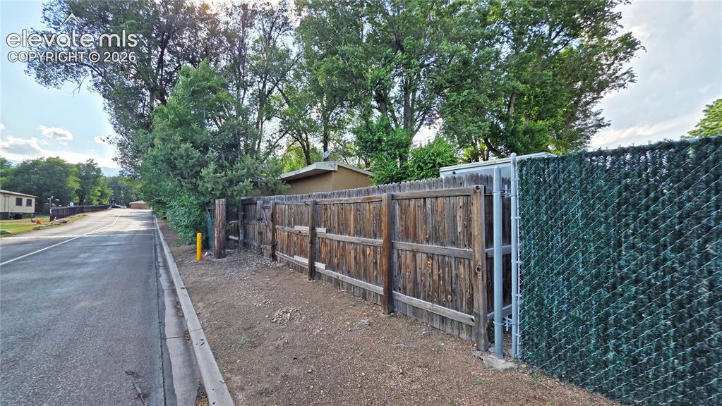 Image 5 of 9: Gate access to The Vanguard High School.