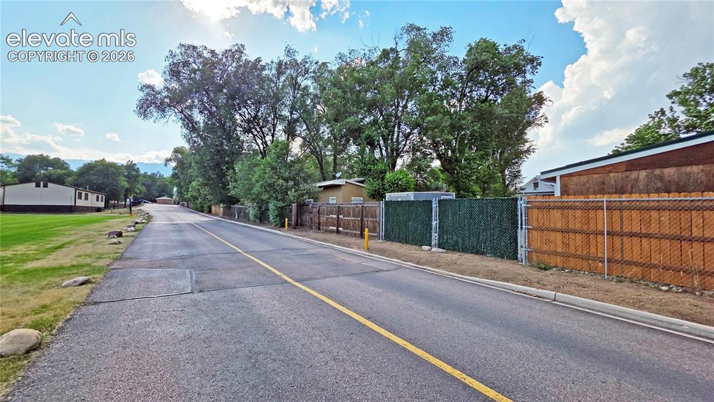 Image 6 of 9: Gate access to The Vanguard High School.