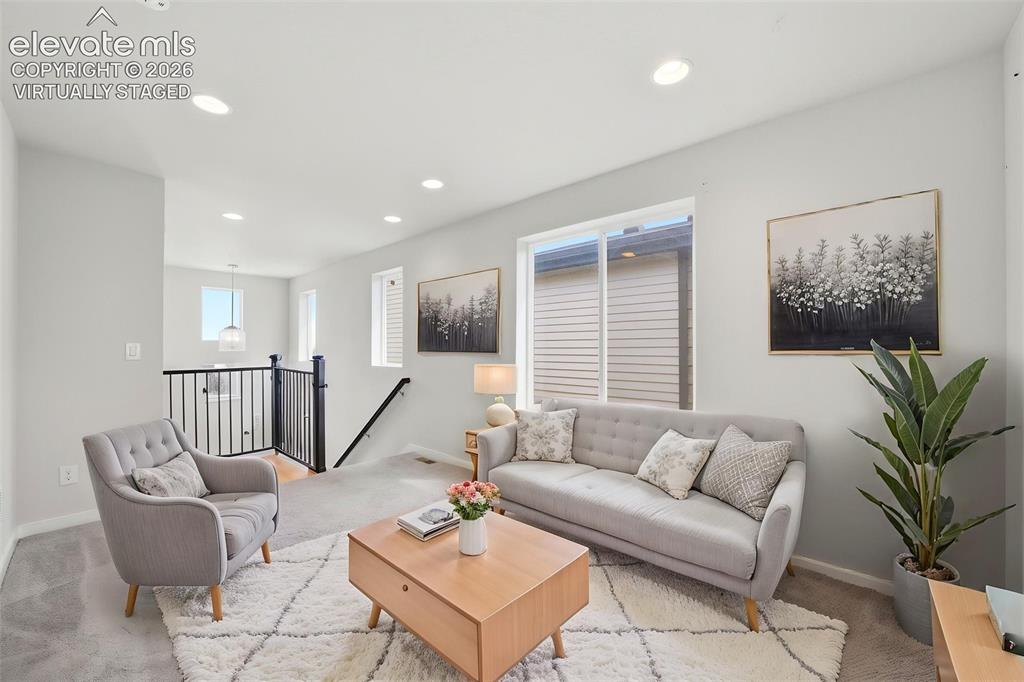 Image 14 of 23: Virtually Staged - Recessed ceiling lighting, light gray wall paint, and wh