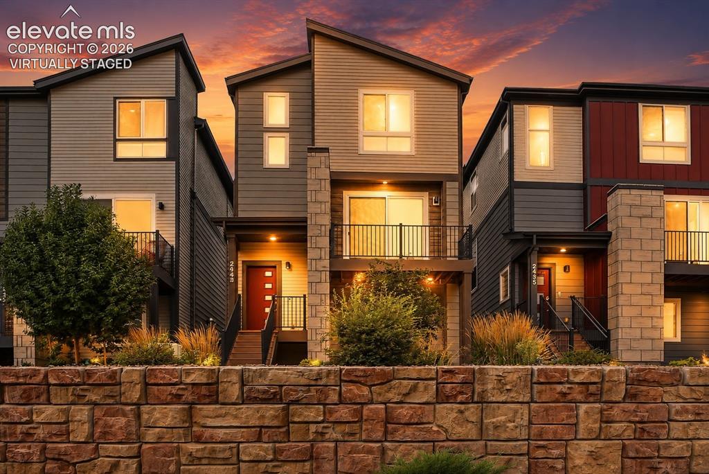 Image 2 of 25: Virtually Staged/Twilight Photo-Modern townhome with multi-level architectu