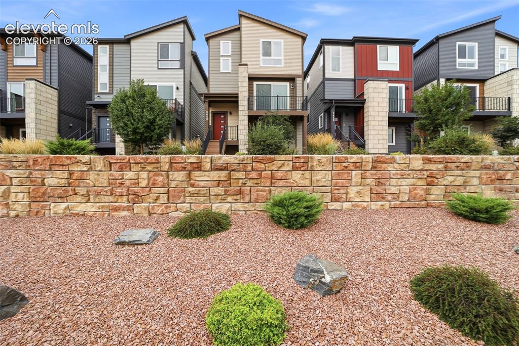 Image 23 of 23: Modern multi-level homes with varied exterior finishes