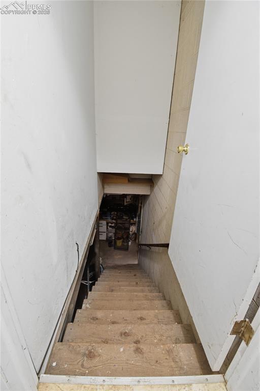 Image 39 of 47: Stairwell to garage & Worksop