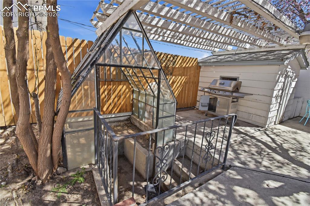 Image 47 of 47: Greenhouse and playhouse