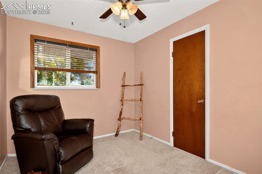 Image 17 of 36: Third main level bedroom with a walk-in closet