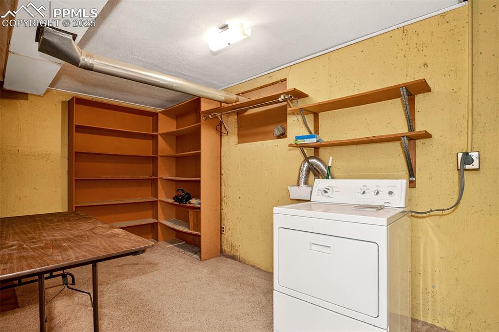 Image 25 of 36: Large utility / laundry room with room for extra storage