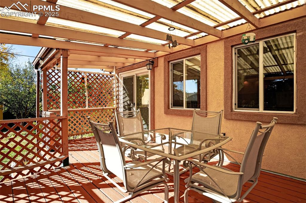 Image 27 of 36: Sliding glass door from the main dining space opens to another relaxing spa